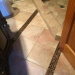 bathroom-floor-copper-accent